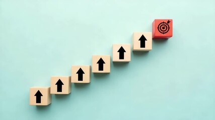 Poster - Wooden blocks with arrows pointing up and a target block on a blue background arranged diagonally