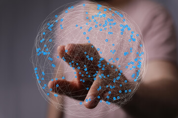 Aufkleber - Abstract image of a hand interacting with a digital sphere, representing global network connections and data.