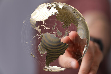 Fototapete - High-quality stock photo of a hand interacting with a digital 3D model of the Earth, representing global connectivity and technology.