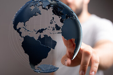 Fototapete - A man interacts with a digital globe, showcasing global connectivity and networking.