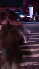 Wall Mural - vertical timelapse low angle view to the asphalt crossing street at intersection area in night time 