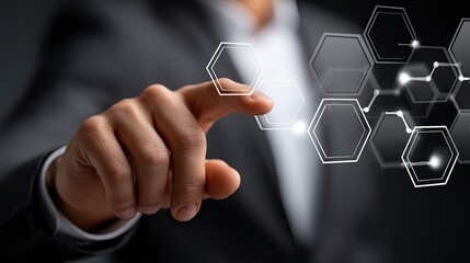 Poster - A businessman touches a digital screen displaying a hexagon pattern, engaging in advanced business technology
