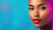© tashechka - Beautiful woman with radiant skin posing against a vibrant blue background