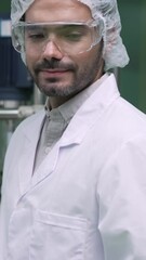 Poster - Portrait of a man scientist in uniform working in curative laboratory for chemical and biomedical experiment