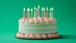 © Quang - Colorful birthday cake with glowing candles on the green background