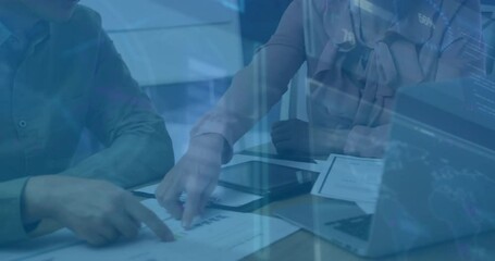Poster - Mid adult woman leading business meeting by pointing at laptop data and guiding colleague in graphs