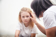 © keleny - Emotional conversation between a woman and a young girl in a minimalist setting during a quiet afternoon