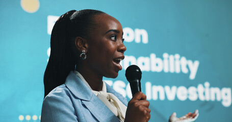 Aufkleber - Black woman, speaking and seminar with mic for sustainability or presentation at summit. Female person, business speaker or presenter with speech for eco friendly investing or campaign at convention