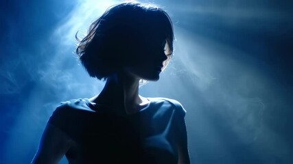 Poster - Short haired model standing in dramatic silhouette, bathed in blue light with swirling smoke, creating mysterious and atmospheric visual performance