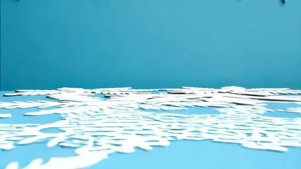 Poster - Delicate white snowflakes arranged on a light blue background, creating a clean and cool winter holiday themed tabletop scene with space for text.
