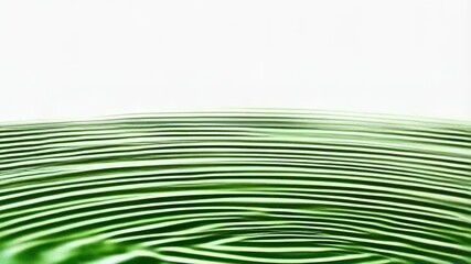 Poster - Pouring stream of green liquid into round container, rippled surface, clear background with green dots, abstract design.