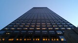 Skyscraper view from a low angle, emphasizing architectural height and corporate office environment