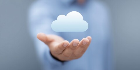 Poster - Person holding a digital cloud symbol in an outstretched hand, representing cloud computing technology and data storage solutions in a modern business environment