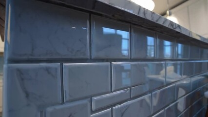 Poster - Glossy white subway tile backsplash with subtle gray veining, modern kitchen wall, marble countertop, white cabinets