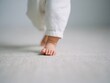 © Cavan - Baby taking first steps on carpet: learning to walk