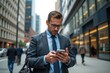 © Cherrin - Businessman in a suit checking his phone on a busy city street.