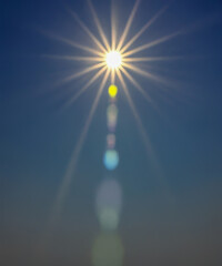 Wall Mural - Sunbeam through the haze on blue sky, vertical