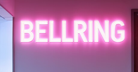 Aufkleber - Bright pink neon sign spells BELLRING against muted wall. Simple design, modern aesthetic, vibrant illumination.