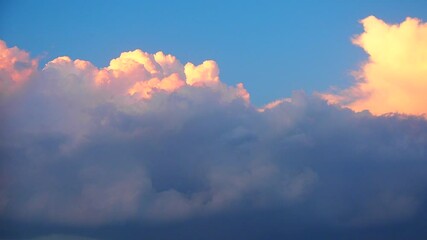 Poster - Soft pastel colors paint the sky as fluffy clouds gather, creating a captivating view. The shifting hues blend seamlessly, inviting reflection and awe during twilight