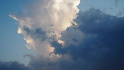Poster - A vibrant sky showcases fluffy white clouds bathed in the warm colors of sunset, casting a serene ambiance over the horizon, perfect for relaxation and contemplation. Time lapse. Evening dawn