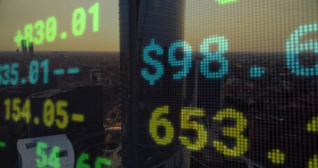 Poster - At start skyline showing numeric figures floating, flickering visualizing market trends at sunset
