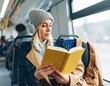© Bambang - Woman reading book on bus (1)
