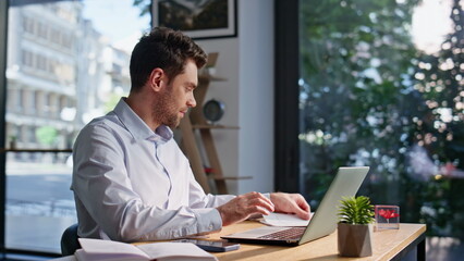 Poster - Happy accountant working laptop looking on business documents smiling closeup.