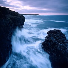Poster - Rocky beach with gentle waves rolling in and crashing on shore creating a serene seascape