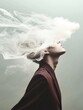 © Ilya - Young asian male surrounded by mystical smoke cloud in thoughtful pose