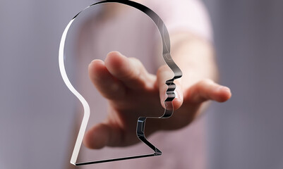 Poster - Abstract image of a hand reaching towards a head outline, symbolizing connection, understanding, or mental health.