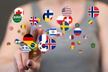 Leinwandbilder - Woman's finger interacts with floating flags, representing global communication and international connections.