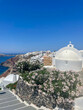 © Justin - church in oia santorini greece framed with flowers