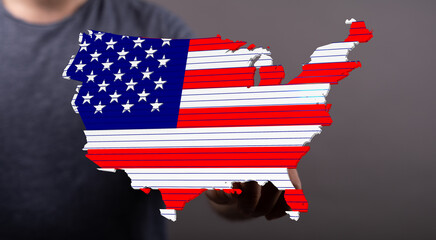 Poster - Digital image of a person holding a US map designed as an American flag. Perfect for patriotic themes.
