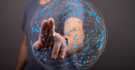 Leinwandbilder - Abstract image of a hand interacting with a digital network sphere.  Global connection concept.