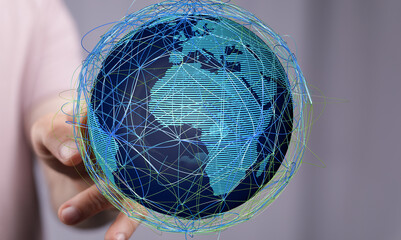 Poster - Stock photo of a hand holding a digital globe illustrating global connectivity and networking.