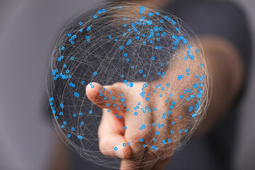 Leinwandbilder - Abstract image of a hand interacting with a digital network, representing global connectivity and data visualization.