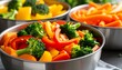 © Maros - Freshly prepared vegetable medley in metal bowls ready to serve