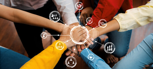A vibrant image of diverse hands coming together in a circle, symbolizing teamwork and collaboration in a dynamic and engaging workspace. Perfect for themes of unity and cooperation. Amity