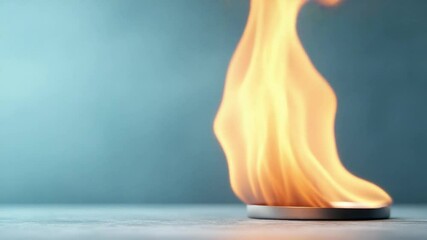 Aufkleber - Flame on Display: The powerful visualization of a fire, its dancing form, colors of orange and yellow against a soft background, conveys themes of energy and transformation.