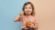 © Luiz  Fernando - Child enjoying a spoonful of dulce de leche, wearing casual clothes, isolated on a pastel background, playful, sweet moment