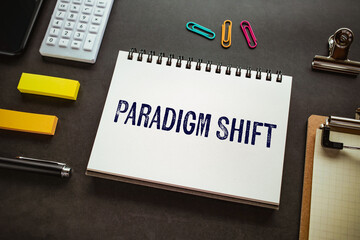 Poster - There is notebook with the word Paradigm Shift. It is as an eye-catching image.