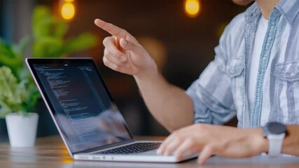 Poster - Coding Vision: A focused coder's hand gestures toward a digital display, showcasing the intersection of creativity and precision in the realm of technological development.