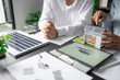© Charlie's - Solar panels green energy Business man working green eco friendly office business creative idea Planing Bio economy for business eco friendly professional Engineer sustainable electricity.