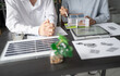 © Charlie's - Solar panels green energy Business man working green eco friendly office business creative idea Planing Bio economy for business eco friendly professional Engineer sustainable electricity.