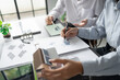 © Charlie's - Solar panels green energy Business man working green eco friendly office business creative idea Planing Bio economy for business eco friendly professional Engineer sustainable electricity.