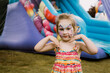 © Cavan Images - Little girl with painted face, summer holidays