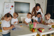 © standret - Having fun by learning. Children in kindergarten with their teacher