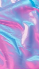 Poster - Flowing iridescent fabric waves. Pink and blue material folds downward. Smooth gentle texture with vibrant pastel colors. Ideal for vertical video content.