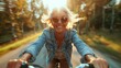 © Pinklife - A spirited older woman enjoying a carefree bike ride in the sunlight, representing freedom, joy, and an active lifestyle, radiating happiness and embracing life with vigor.