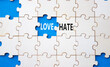 © Natallia - Love vs Hate symbol. Concept word Love vs Hate on wooden puzzle. Beautiful blue background. Business and Love vs Hate concept. Copy space